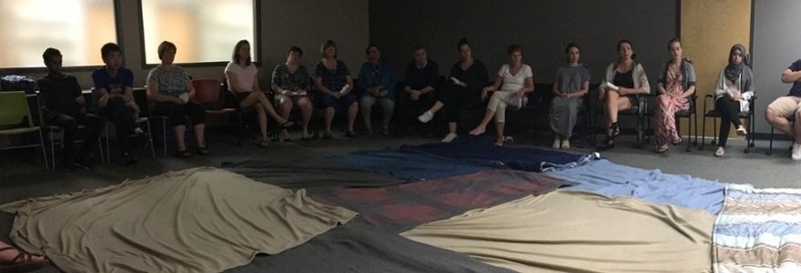 Participants take part in the Kairos Blanket Exercise.