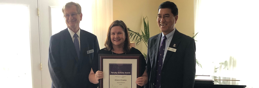 Claire accepts her faculty scholar award from Andrew Hrymak (Western University Provost & Vice-President of Academics) and Amit Chakma (Western University President & Vice-Chancellor) on April 24, 2019. 