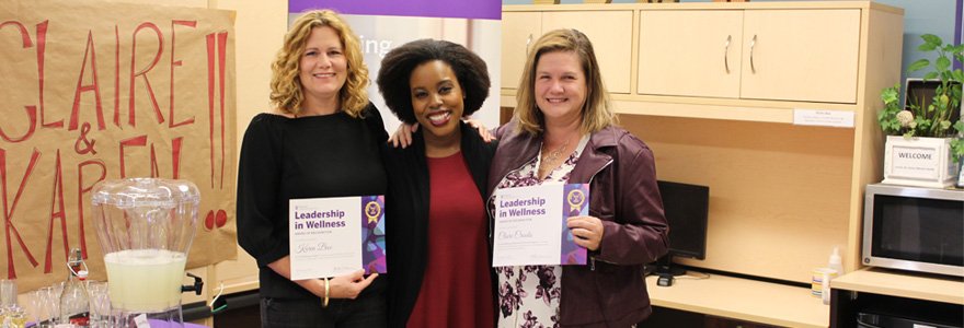 Dr. Melanie-Anne Atkins of Western's Wellness Education Centre presents Dr. Crooks and Dr. Bax with their awards.