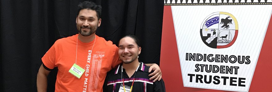 Mike Cywink, Student Mentor and Program Liaison, The Fourth R: Uniting Our Nations and Tsista Kennedy, Canada's first Indigenous Student Trustee, TVDSB pose for a photo together.