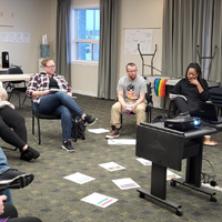 LGBT2Q+ and GSA Training. Currently sitting in group circle